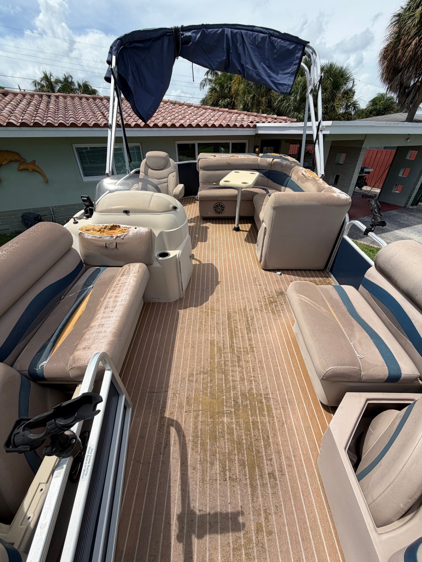Pontoon rear seating and deck after cleaning and restoration